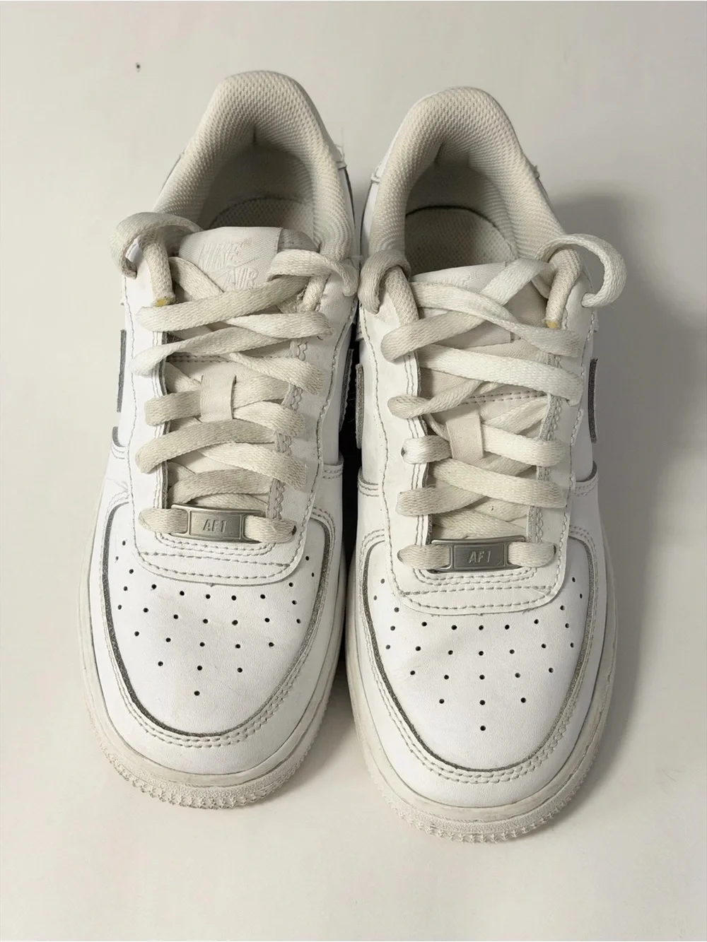 Nike Kids White Low-Top Sneakers with Silver Accents